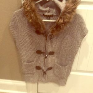 Unique sweater vest with fur hood